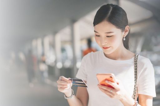 Woman holding credit card