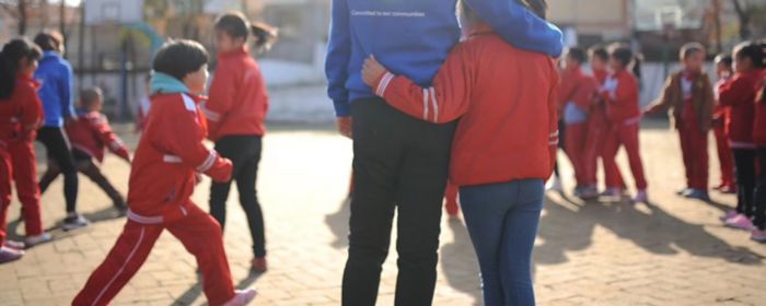 Woman volunteering with children